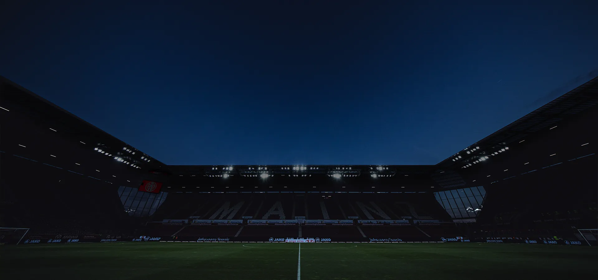 Photo taken from the side of the MEWA ARENA in the dark with dim floodlights (Photo)